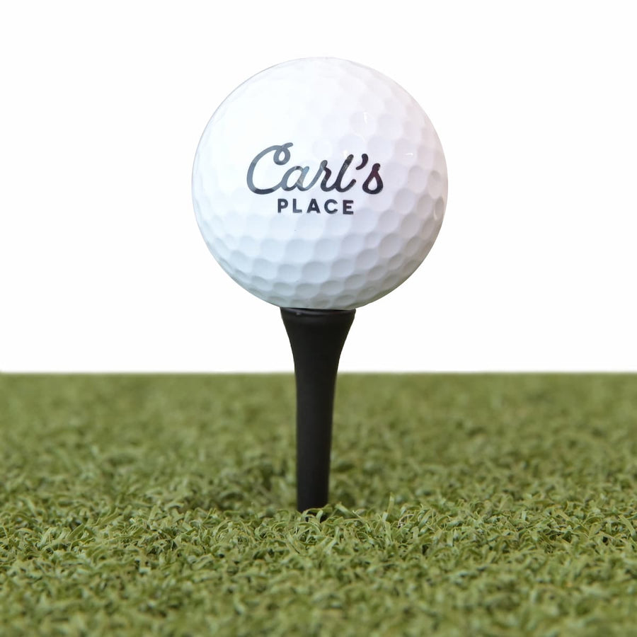 Golf ball teed up on turf