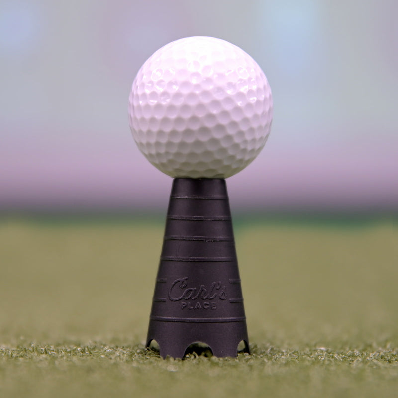 Ball teed up inside a golf simulator