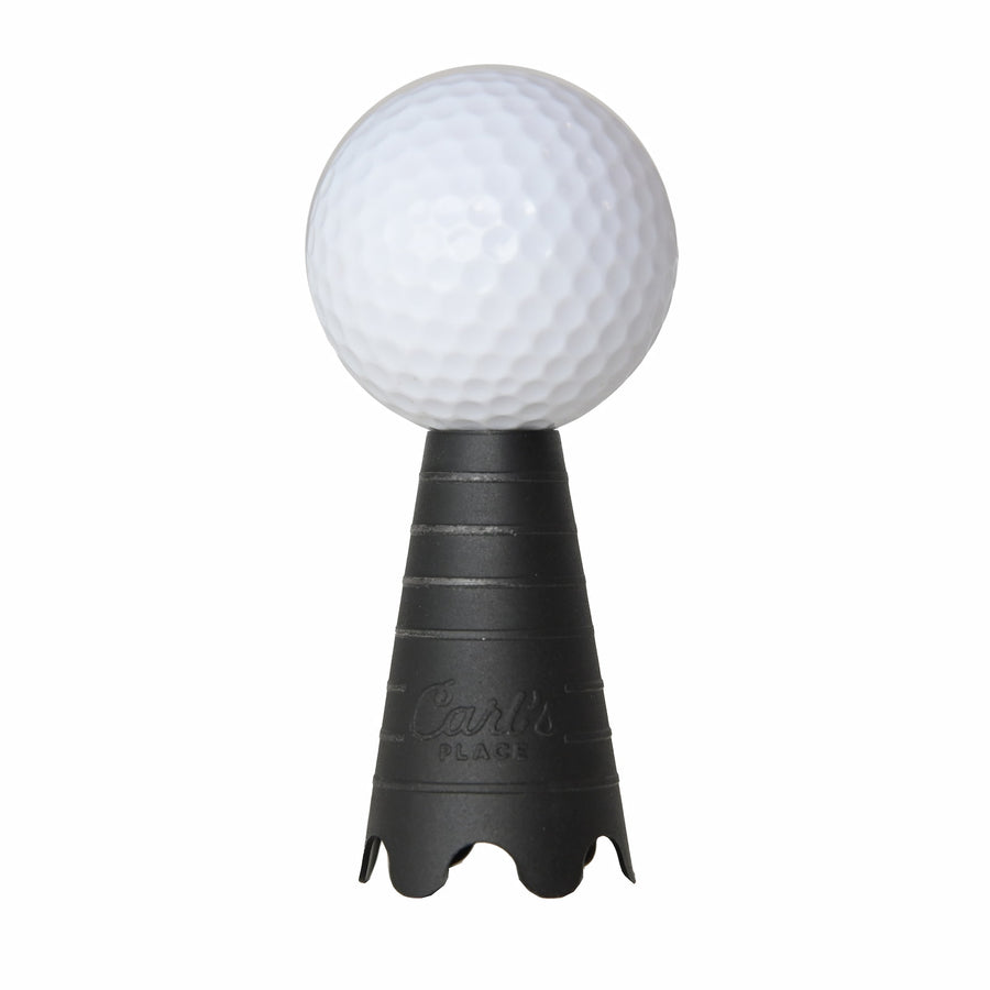 Golf ball resting on rubber simulator tee