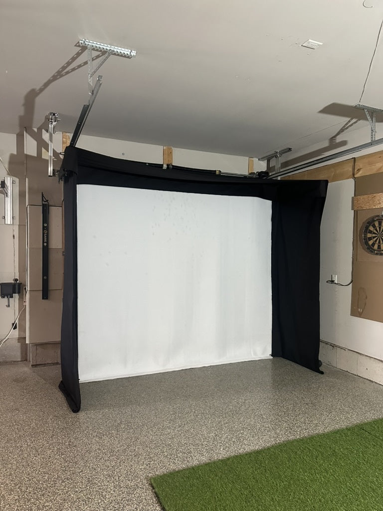 SportScreen Vanish LITE installed in garage, mounted around garage door rails