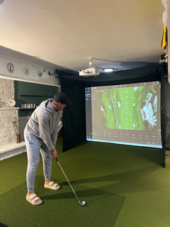 SportScreen Vanish Series retractable golf simulator enclosure — in use