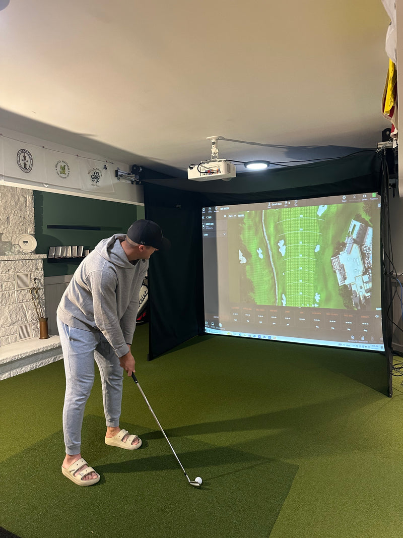 SportScreen Vanish Series retractable golf simulator enclosure — in use