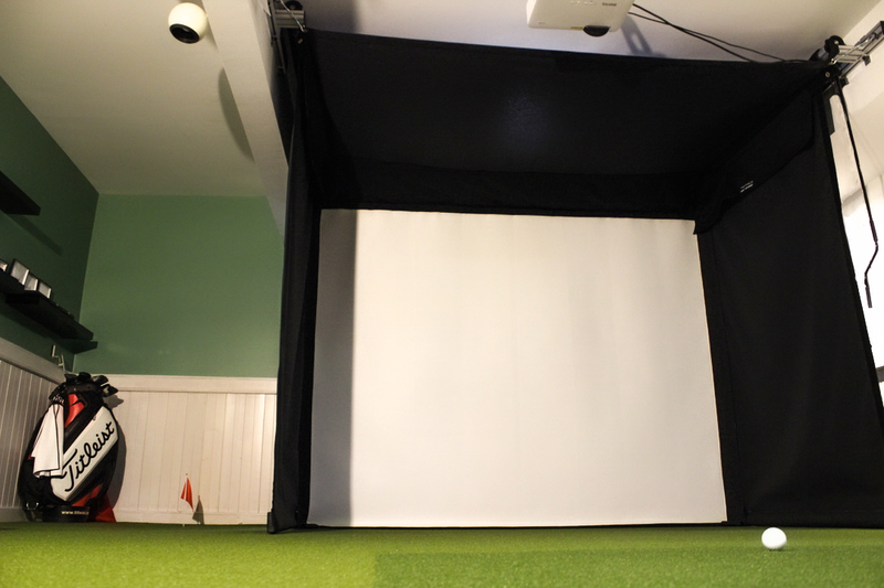 SportScreen Vanish Series retractable golf simulator enclosure — with side putting green
