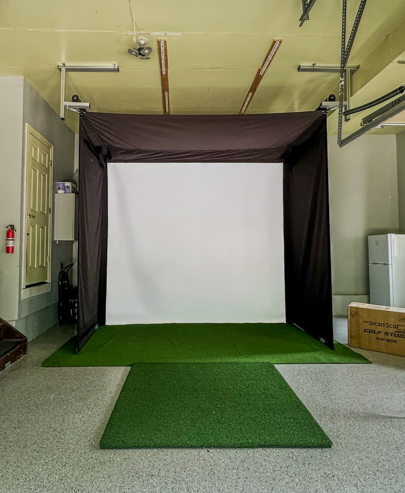 SportScreen Vanish Series retractable golf simulator enclosure — installed garage